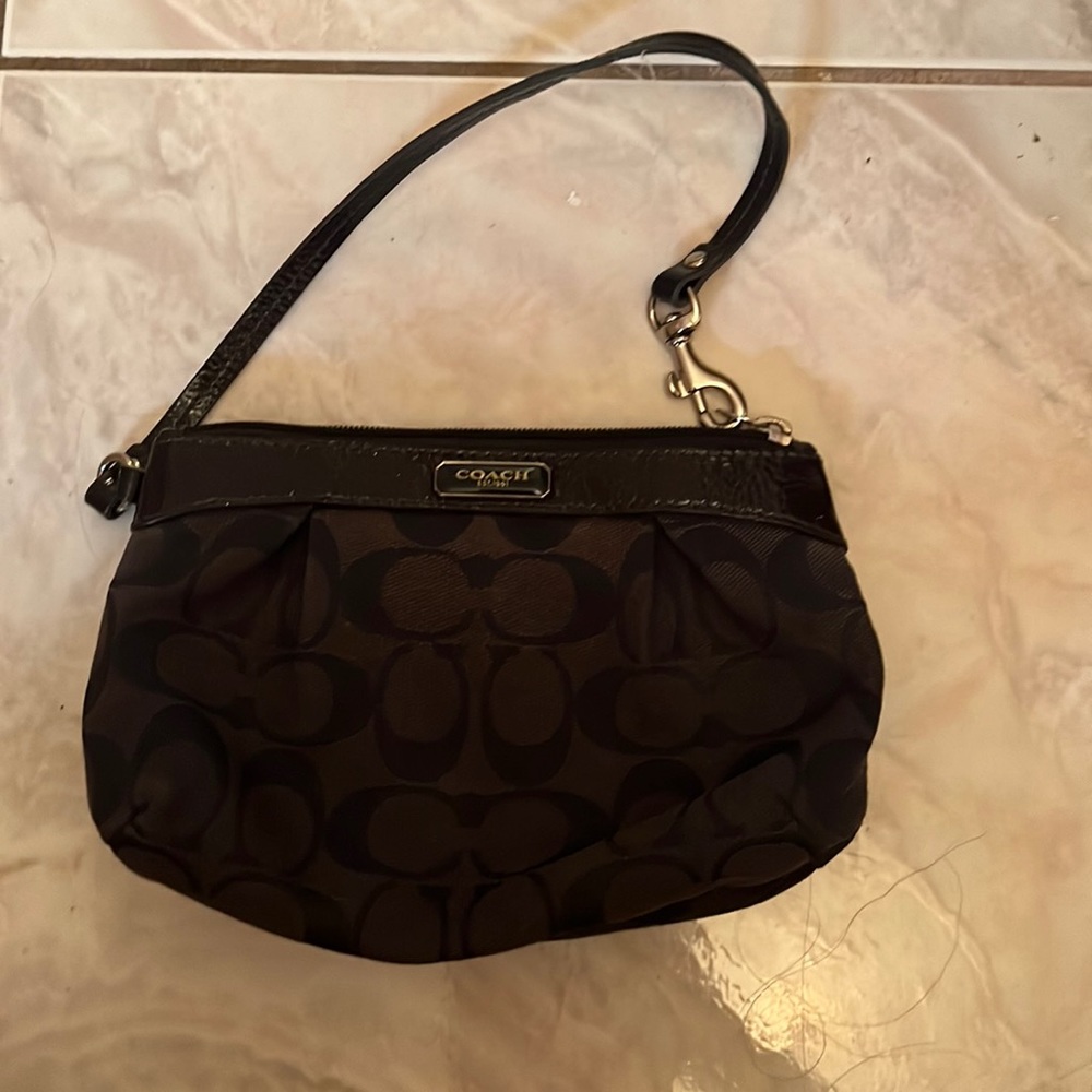 Used Coach navy blue wristlet
